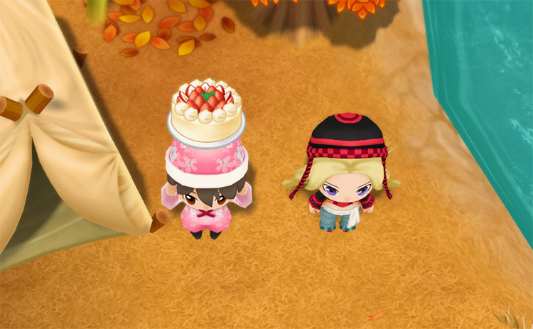 The farmer stands next to Jennifer while holding a Strawberry Cake. / Story of Seasons: Friends of Mineral Town