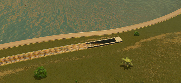A tunnel entrance like this appears when your tracks go from ground level to underground. / Cities: Skylines