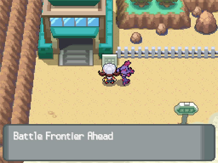 Reading the sign in front of the gate leading to the Battle Frontier on the upper left of Route 40 / Pokemon HGSS