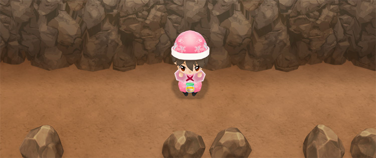 The farmer drinks a bottle of Super Caffeine to restore fatigue while mining. / Story of Seasons: Friends of Mineral Town