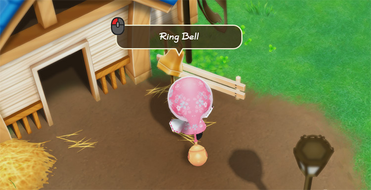 The farmer rings the bell outside the Coop. / Story of Seasons: Friends of Mineral Town