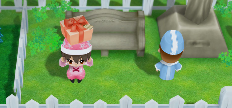 Holding a gift next to Carter in Story of Seasons: FoMT