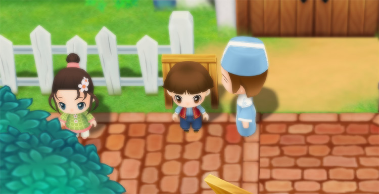 Yu stands next to Carter and Mei in front of the Church. / Story of Seasons: Friends of Mineral Town