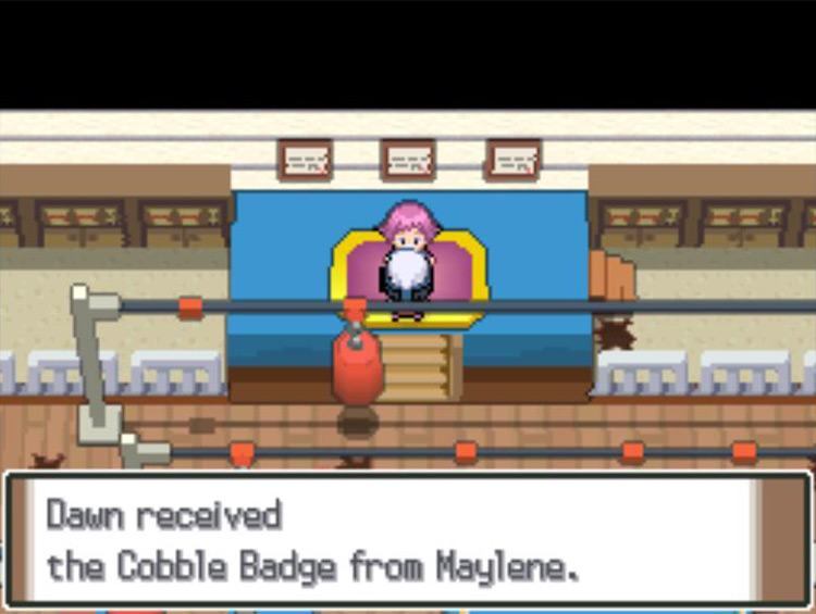 Receiving the Cobble Badge after defeating Leader Maylene. / Pokémon Platinum