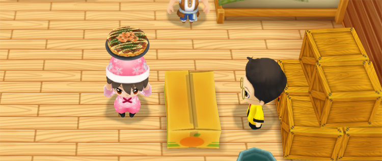 The farmer stands in front of Huang’s counter while holding Okonomiyaki. / Story of Seasons: Friends of Mineral Town