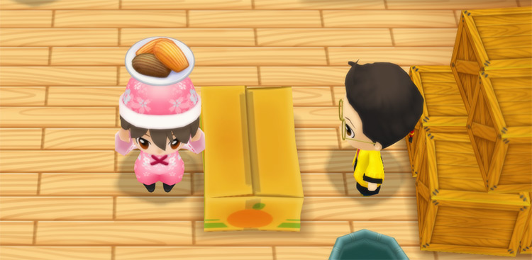 The farmer stands in front of Huang’s counter while holding a plate of Madeleines. / Story of Seasons: Friends of Mineral Town