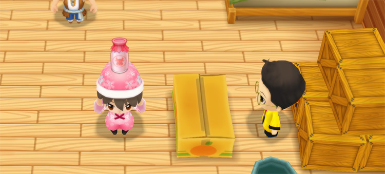 The farmer stands in front of Huang’s counter while holding a glass of Strawberry Milk. / Story of Seasons: Friends of Mineral Town