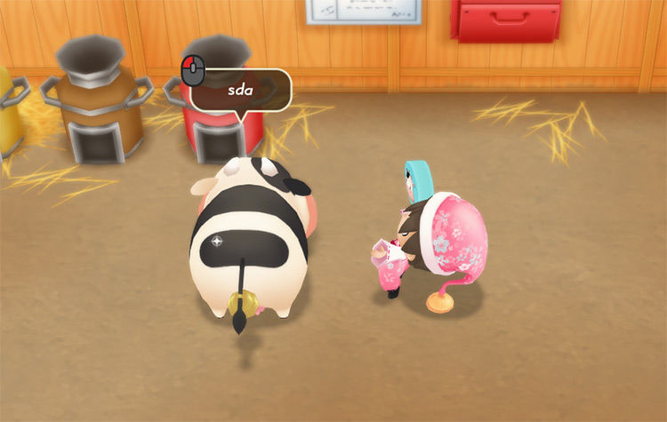 The farmer uses a Breeding Kit on an adult cow. / Story of Seasons: Friends of Mineral Town
