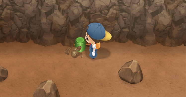 The farmer breaks a rock in the Spring Mine. / Story of Seasons: Friends of Mineral Town