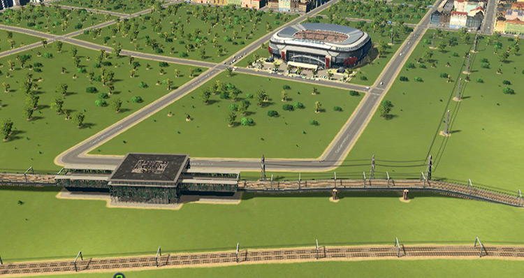 This football stadium is built near a train station with an intercity connection, making it easy for tourists to come in large numbers / Cities: Skylines