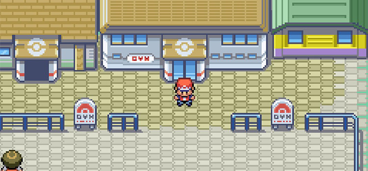 Standing outside the Saffron City Gym in Pokémon FireRed