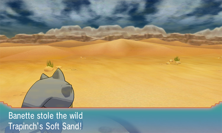A Banette steals a wild Trapinch’s Soft Sand using this held item farming method. / Pokémon Omega Ruby and Alpha Sapphire