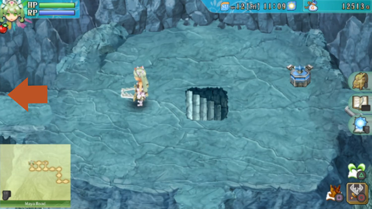 An area on Maya Road with a blue switch and steps leading to a cave / Rune Factory 4