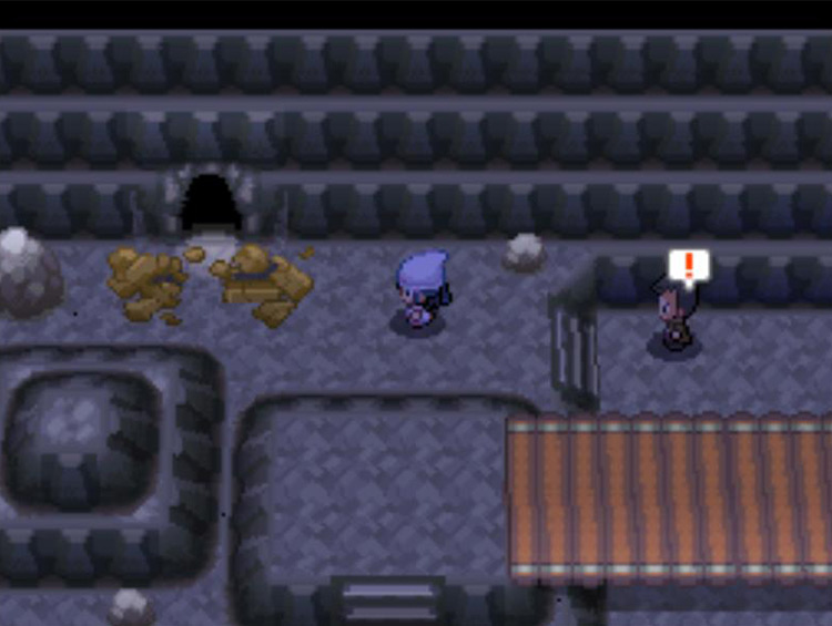Looker making an appearance at the broken cave painting. / Pokémon Platinum