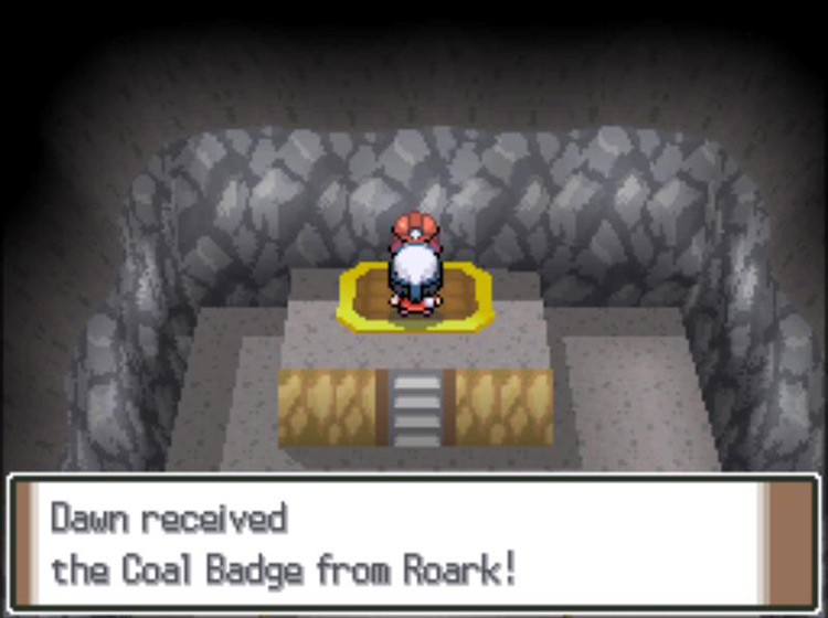 Receiving the Coal Badge after defeating Leader Roark in battle / Pokémon Platinum