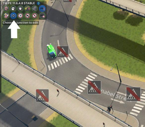 Click the Junction Restrictions button on the Traffic Manager panel. / Cities: Skylines
