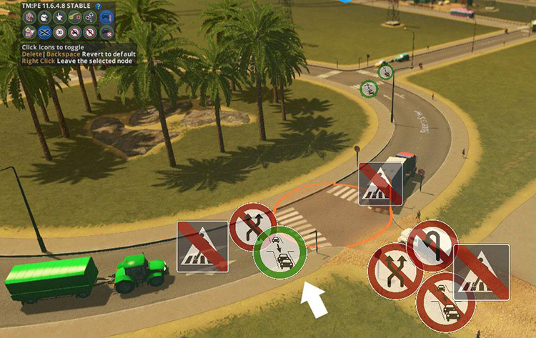 This “Vehicles may enter blocked junctions”  icon being set to green means the vehicles on the roundabout can keep driving onto the junction instead of waiting for space on the next road segment. / Cities: Skylines