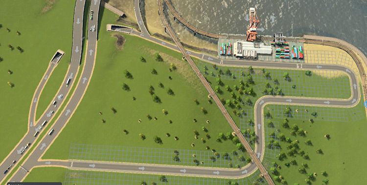 This long access road allows plenty of room for trucks to queue if the cargo hub becomes busy / Cities: Skylines