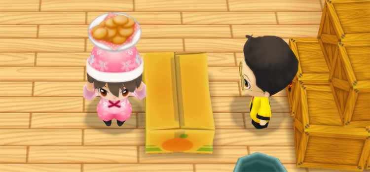 The farmer stands in front of Huang’s counter while holding a plate of Cookies. / Story of Seasons: Friends of Mineral Town