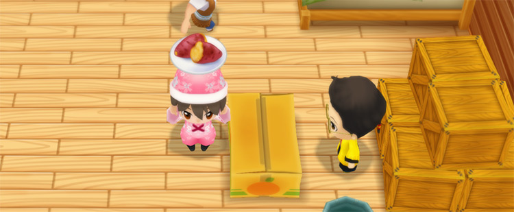 The farmer stands in front of Huang’s counter while holding a plate of Baked Yam. / Story of Seasons: Friends of Mineral Town