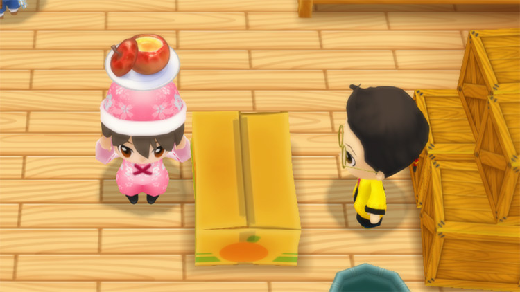 The farmer stands in front of Huang’s counter while holding a Baked Apple. / Story of Seasons: Friends of Mineral Town