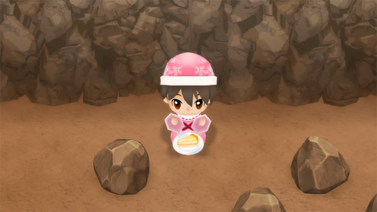 The farmer eats Cheesecake to restore stamina while mining. / Story of Seasons: Friends of Mineral Town