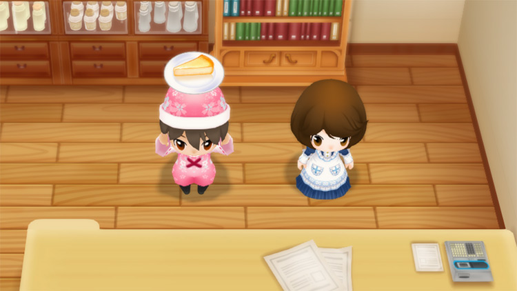 The farmer stands next to Elly while holding a slice of Cheesecake. / Story of Seasons: Friends of Mineral Town