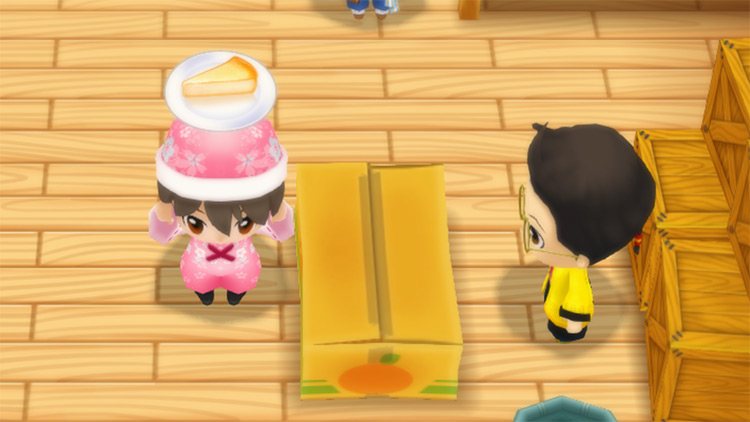 The farmer stands in front of Huang’s counter while holding a slice of Cheesecake. / Story of Seasons: Friends of Mineral Town