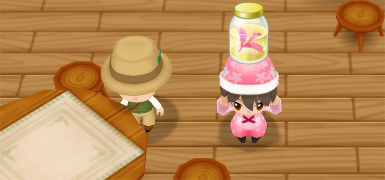 The farmer stands next to Basil while holding a bottle of Elli Leaves. / Story of Seasons: Friends of Mineral Town