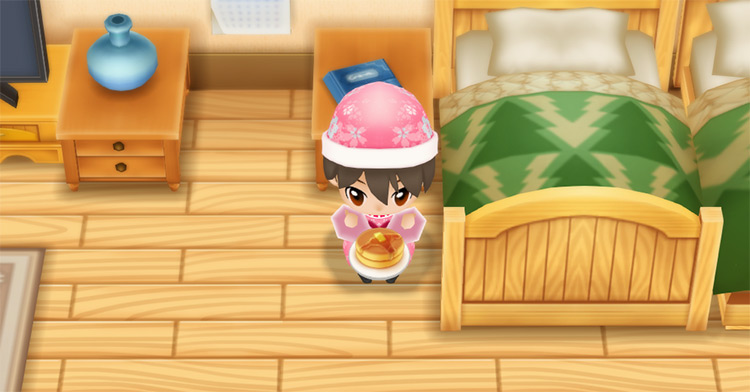 The farmer eats a stack of Pancakes to restore stamina in the morning. / Story of Seasons: Friends of Mineral Town
