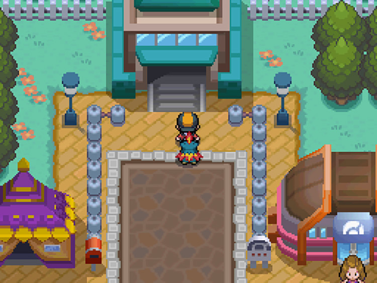 The player standing outside the North exit of Goldenrod City / Pokemon HGSS