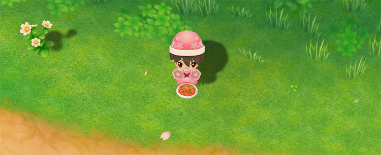 The farmer eats a plate of Napolitan to restore stamina while foraging. / Story of Seasons: Friends of Mineral Town