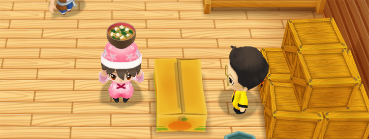 The farmer stands in front of Huang’s counter while holding Miso Soup. / Story of Seasons: Friends of Mineral Town