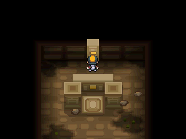 The player standing in front of the Water Stone panel in the Ruins of Alph / Pokémon HGSS