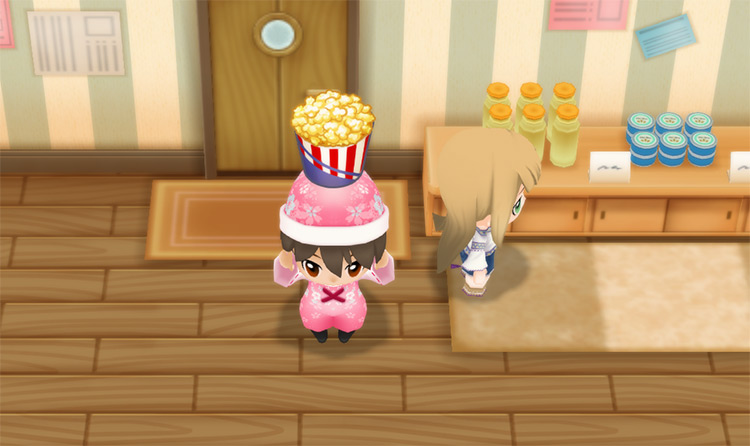 The farmer stands next to Karen while holding a bucket of Popcorn. / Story of Seasons: Friends of Mineral Town