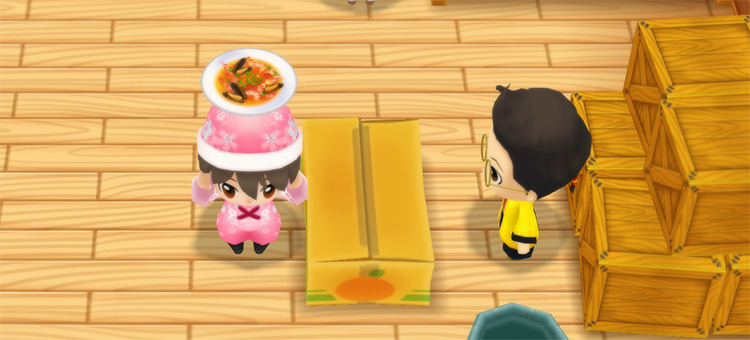 The farmer stands in front of Huang’s counter while holding a bowl of Fish Soup. / Story of Seasons: Friends of Mineral Town