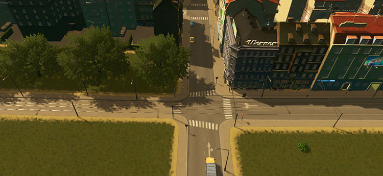 Standalone tram tracks (left side) going into a two-lane road with tram tracks (right side). / Cities: Skylines